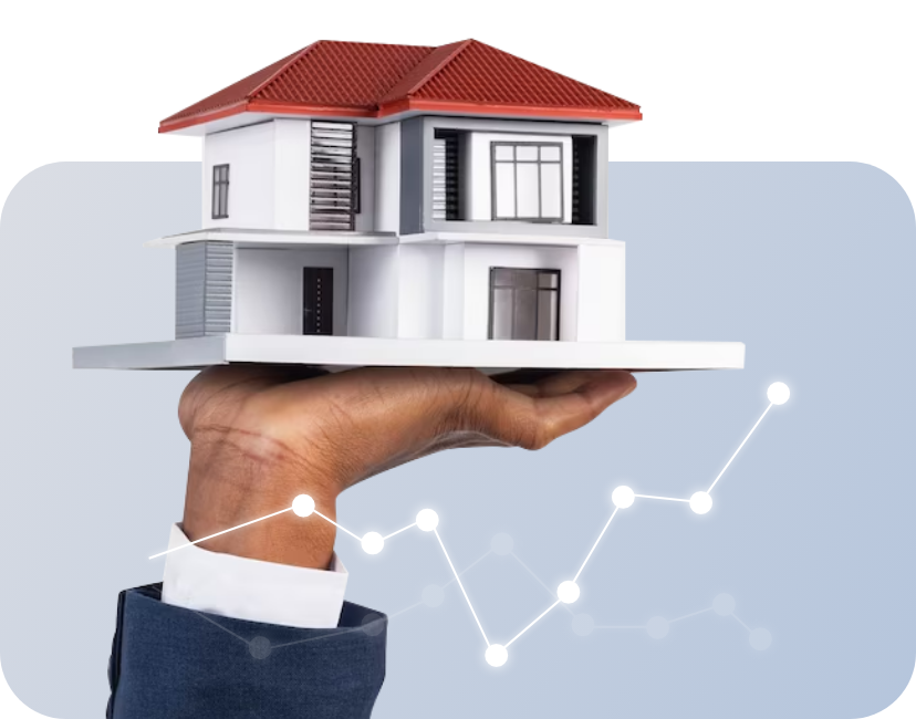 Casa miniatura posada sobre mano con una grafica inmobiliaria